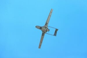An aerial drone flying under a clear blue sky in Adana, Türkiye.