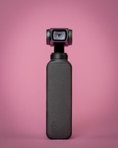 black and gray camera on red background